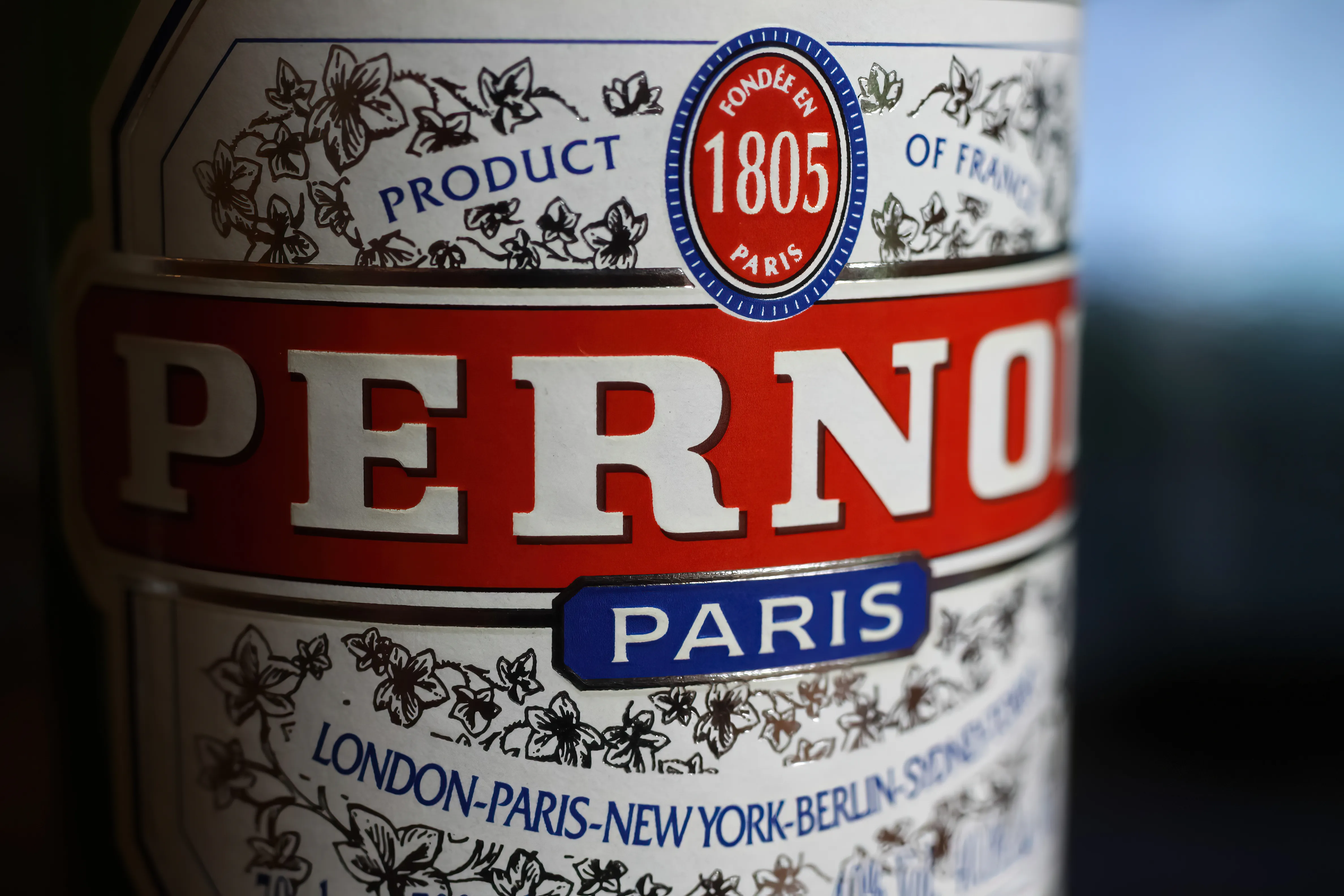 A bottle of Pernod and a full glass
